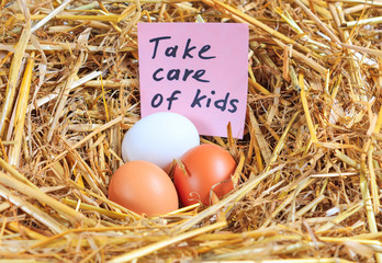 Three chicken eggs and a note