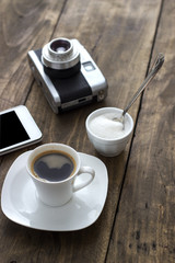 Cup of coffee with sugar on wooden table