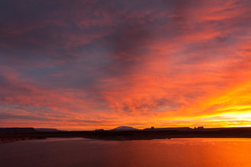 Lake Powell at sunrise, clouds and sunlight