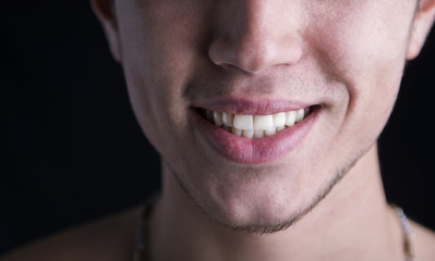White teeth of a smiling young man