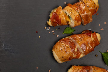 Prosciutto Wrapped Chicken breast. Selective focus.