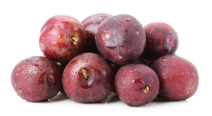 purple plums group isolated on the white background
