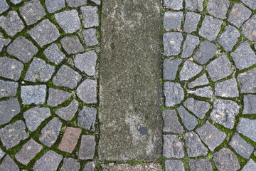 Old stone paving stones on the road
