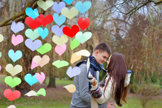couple in love on Valentine's Day in the Park with hearts