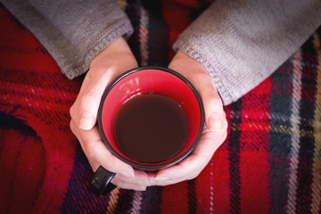 Warming with TEA male hands holding a cup of tea 