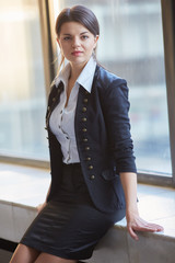 Young business woman in the hallway