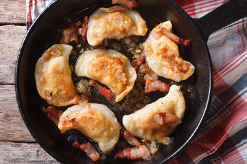 fried dumplings in a pan macro. horizontal top view