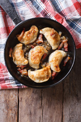fried dumplings in a pan close-up. vertical top view