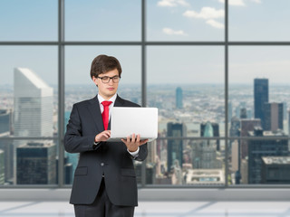 businessmen holding laptop