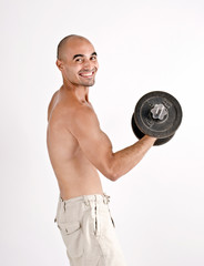 Fototapeta na wymiar Strong man lifting weights for the biceps. Bodybuilder training.