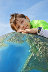 child holding Earth in hands
