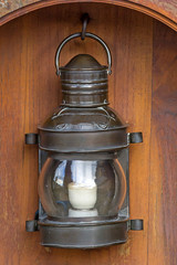 Oil Lamp at Night on a Wooden Surface