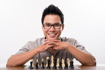 Happy Asian chess player