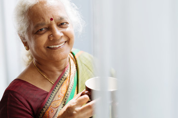 Indian woman with a mug