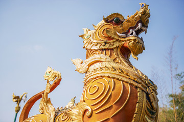 Fototapeta na wymiar Thai golden lion statue style in Thai temple
