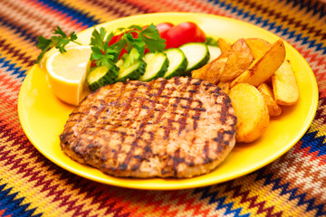 Pork with peppers with lemon and potatoes