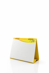 Yellow blank paper desk spiral calendar.