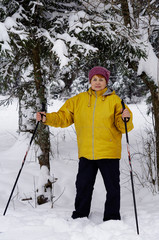 An old woman skiing in the forest