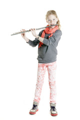 young girl with red hair and freckles plays flute © ahavelaar