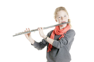 young girl with red hair and freckles plays flute © ahavelaar
