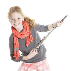 young girl with red hair and freckles holding flute © ahavelaar