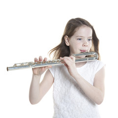 young girl with brown hair holds flute in studio © ahavelaar