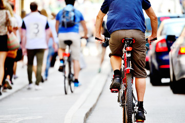 Fototapeta na wymiar Bicyclists in traffic