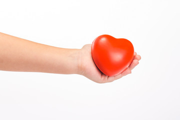 Children hand holding red heart