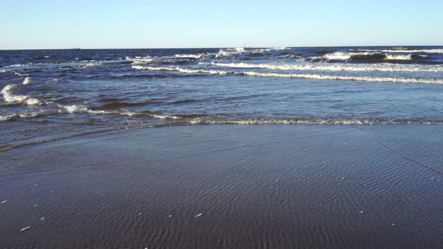 Sea in December storms and waves beat against the shore
