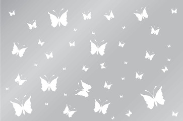 White butterflyes on grey wallpaper gradient