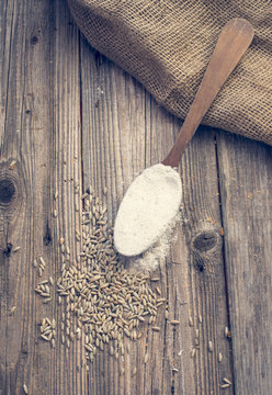 White wheat in a spoon and seeds