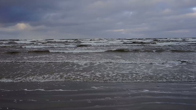 Sea in December storms and waves beat against the shore
