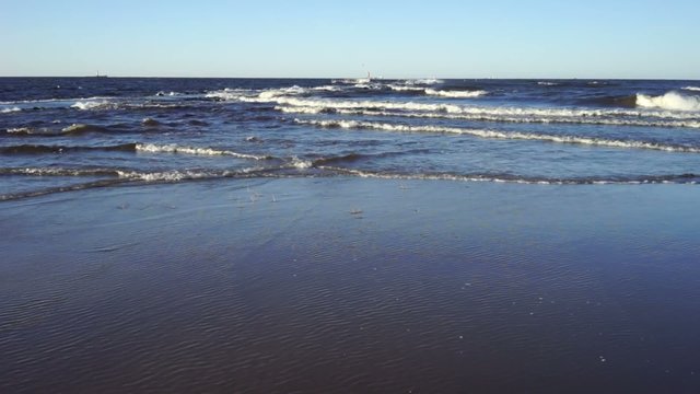 Sea in December storms and waves beat against the shore