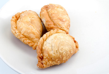 fried Curry Puffs on white dish