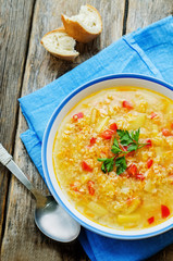 soup with salmon, potatoes and millet