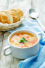 soup with salmon, potatoes and millet