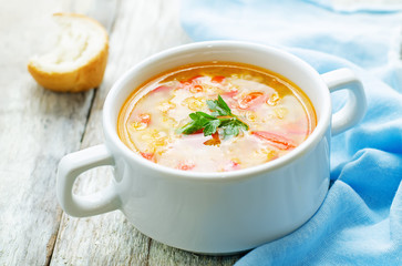 soup with salmon, potatoes and millet