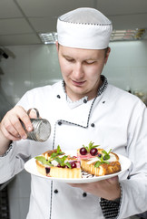 chef preparing food in the kitchen at the restaurant