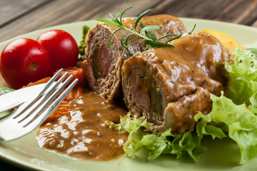 Pork rolls with prepared potatoes and vegetables