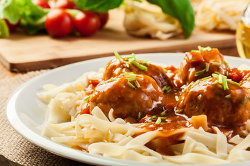 Pasta fettuccine and meatballs with tomato sauce