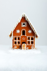 The hand-made eatable gingerbread house and snow decoration - 75239026