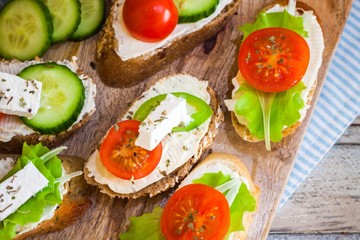 Delicious snacks for breakfast on wooden table