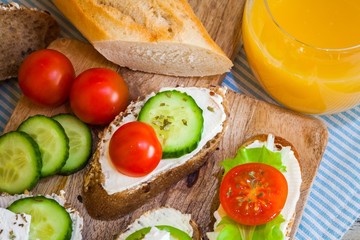 Delicious snacks for breakfast on wooden table