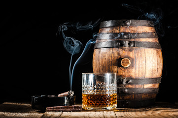 Glass of alcohol and smoking noble cigar on a black background - 75239809