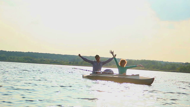 Happy boyfriend girlfriend enjoying boat ride, relaxation, water