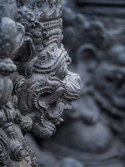Fototapeta na wymiar Gardian statue at the Bali temple entrance