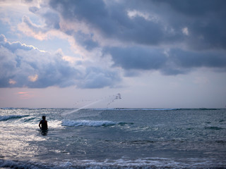 Fisherman on the beach of Kuta in Bali