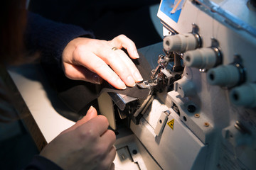 Seamstress sews garments luxury made in italy
