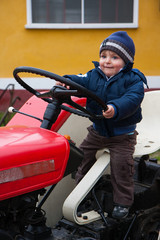 baby on tractor old