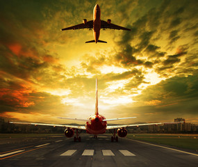 passenger plane ready to take off on airport runways with urban